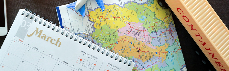 030623 Shipping to Asia calendar Concept of shipping and logistics management. Use smart phone for parcel tracking in the mobile application.