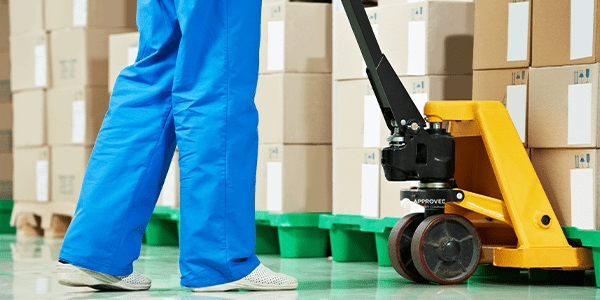 600×300 medical transport person transports medical supplies on a pallet