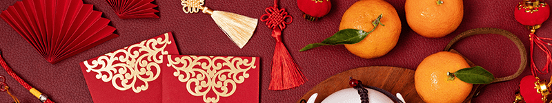 010923 Lunar New Year 2 Chinese new year festival decoration. Traditional lunar new year flat lay with green tea, red paper fans, cherry blossom.