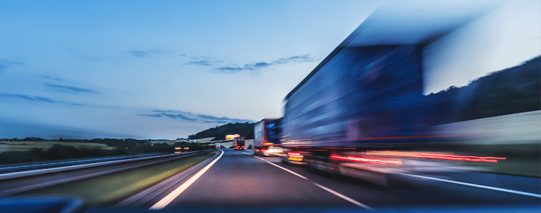 freight trucks traveling road