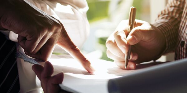hands-closeup-writing-is-left hands writing plan