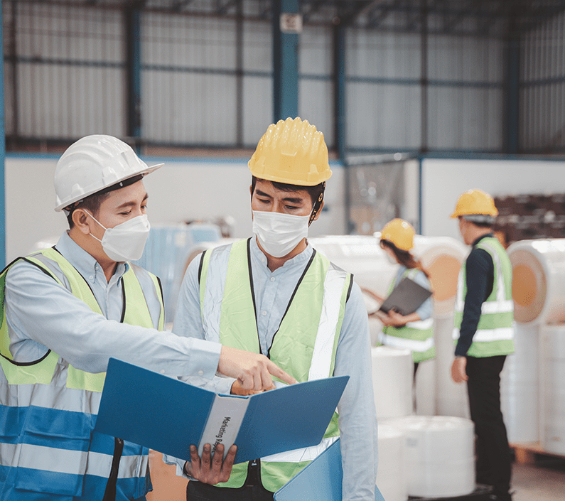 796×705 medical shipping Factory manager and engineer in medical mask and safety protective suite using computer laptop and digital tablet working discuss together
